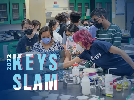 Teacher with students in lab. 