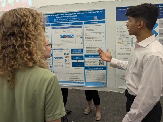 Student explaining poster