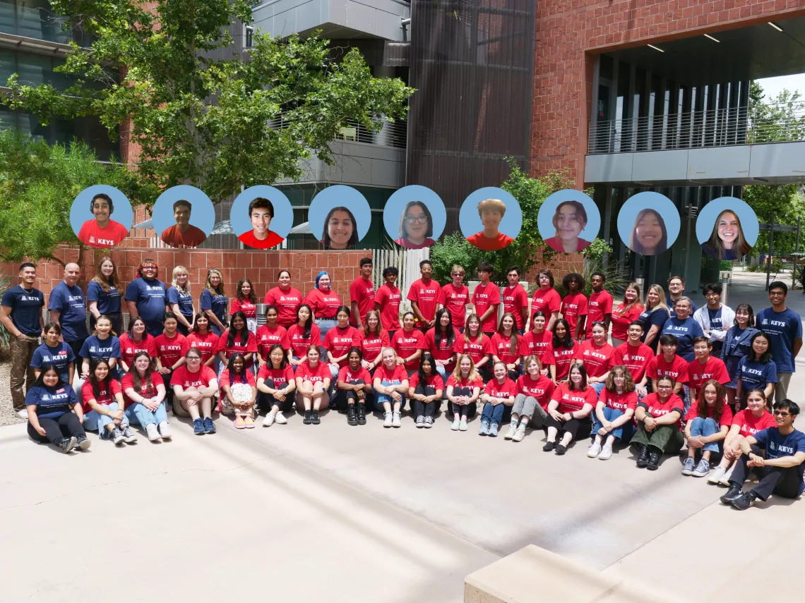 Group of people involved in the KEYS Research Internship sitting and standing outside