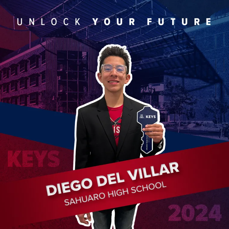 A high school student holding a paper key