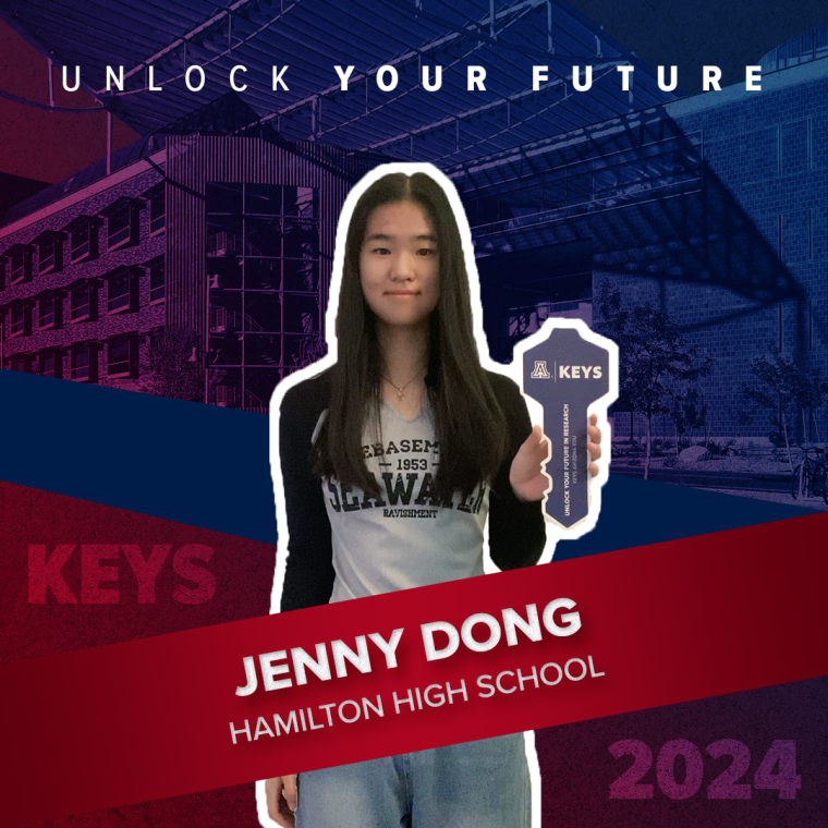 A high school student holding a paper key