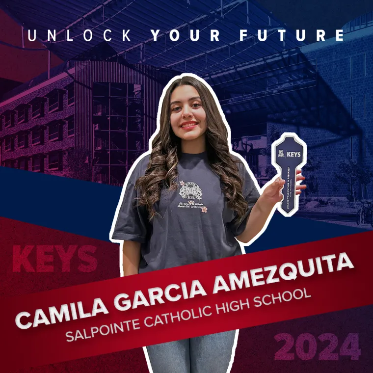 A high school student holding a paper key