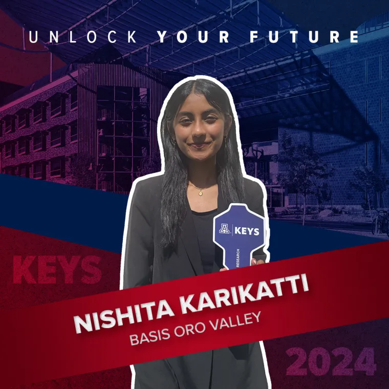 A high school student holding a paper key