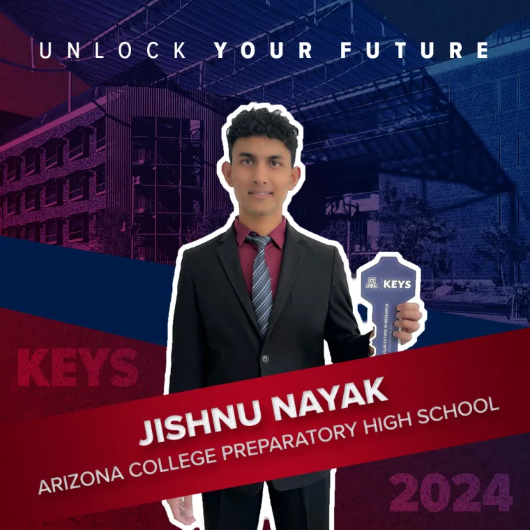 A high school student holding a paper key