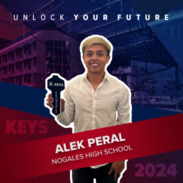 A high school student holding a paper key
