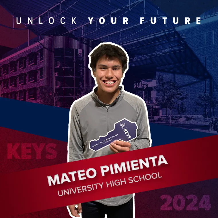 A high school student holding a paper key
