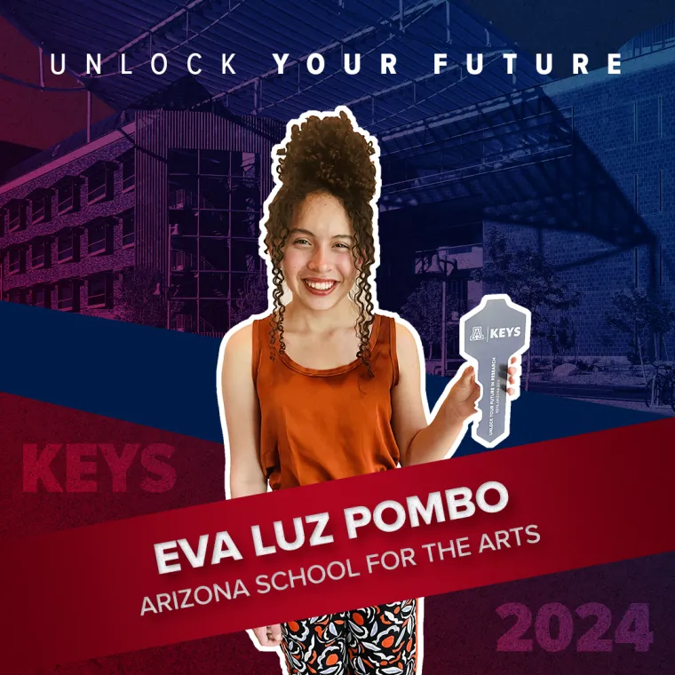 A high school student holding a paper key