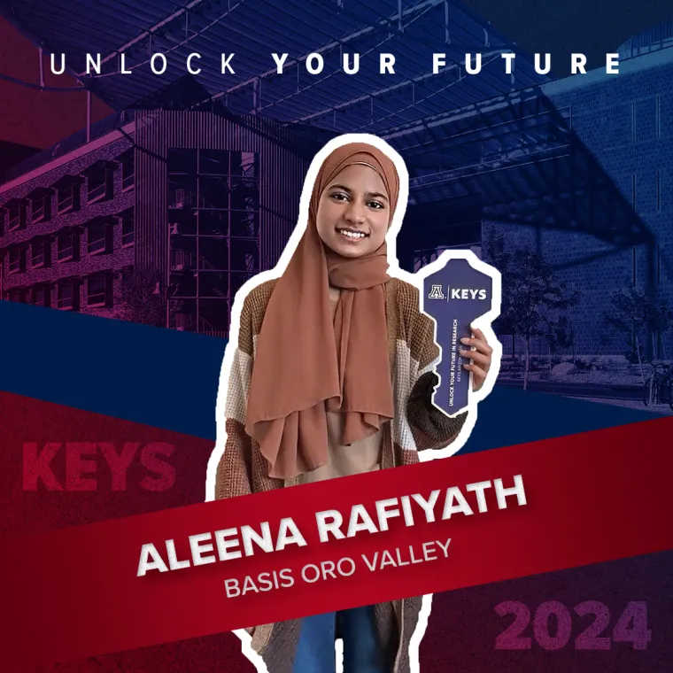 A high school student holding a paper key
