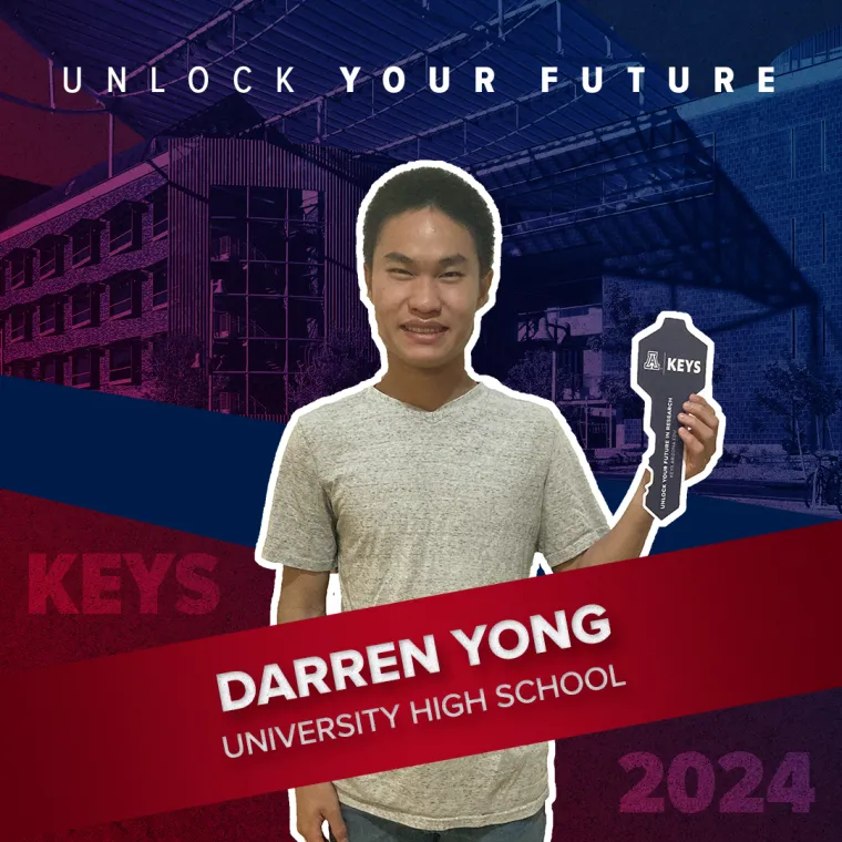 A high school student holding a paper key