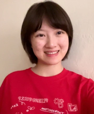 KEYS intern wearing red KEYS shirt, with a white background